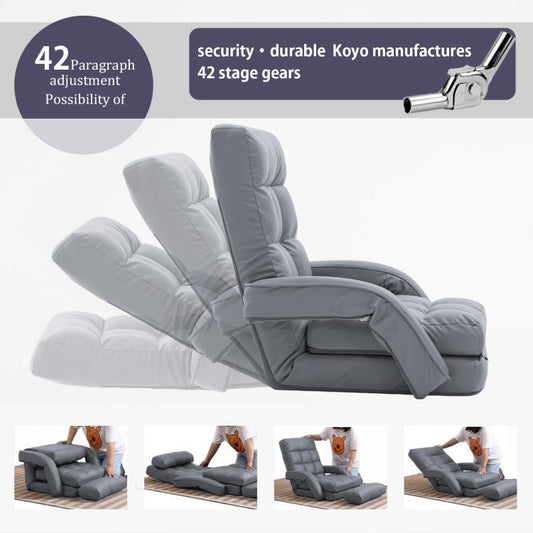 Grey reclined folding lounge chair with cushioned backrest and head pillow