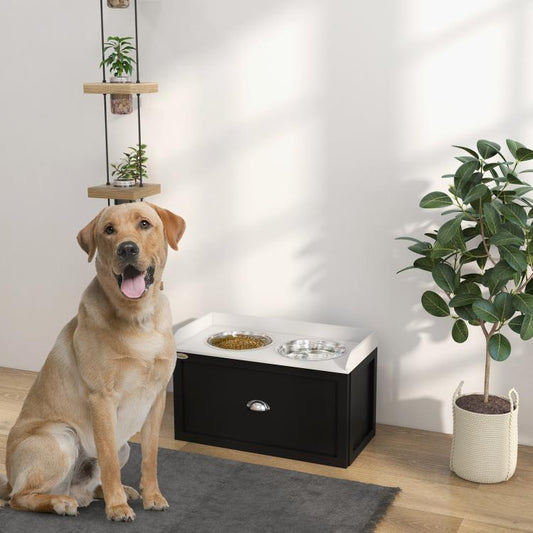 Pet feeding station with two metal bowls and storage drawer, in use with a yellow dog