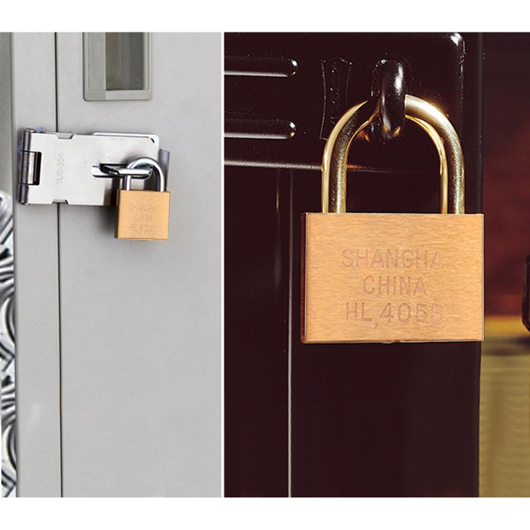 Copper padlock mounted on a door with tan body and engraved markings