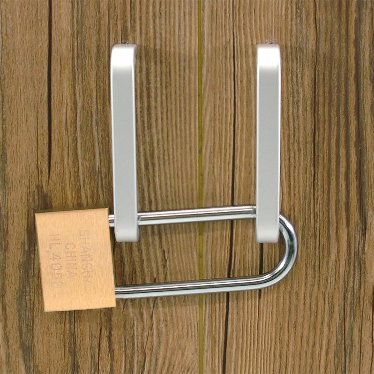 Long-beam padlock mounted on a wooden door with copper-colored body
