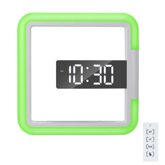 Square digital alarm clock with green glow frame and LED time display reading 10:30