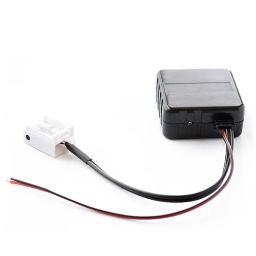 Car Bluetooth AUX adapter module with black housing, white plug, and cable leads
