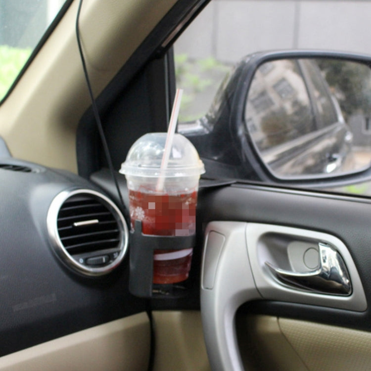 Car drink holder with clear-lid cup and straw on passenger side