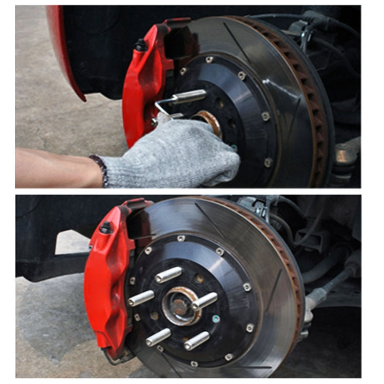 Hand installing wheel stud adapters onto vehicle brake rotor hub