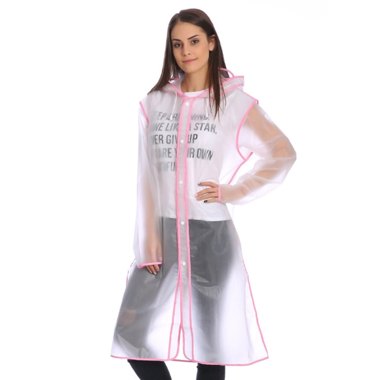 Transparent rain poncho with pink trim, hood, and snap-front