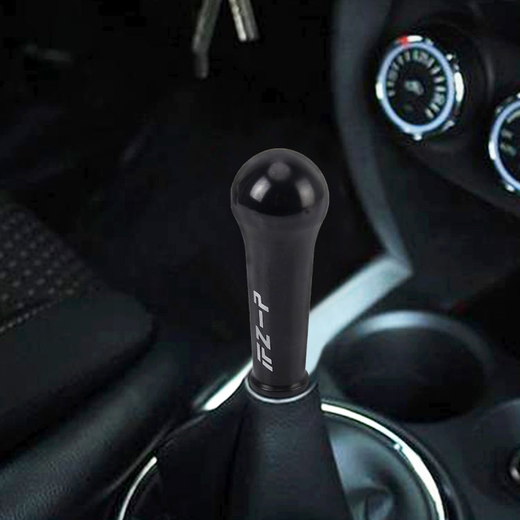 Black shift knob cover installed in a car interior over the gear selector
