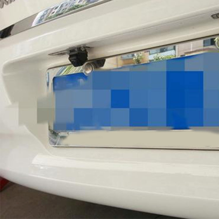 Rear bumper installation area with universal backup camera mounted under the license plate