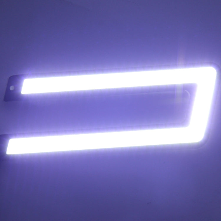 Lit car DRL LED light bars emitting bright white light