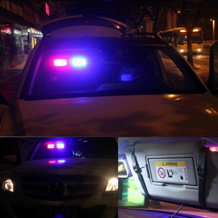Car LED strobe warning light bar flashing blue and white on dashboard area