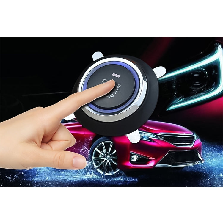 Hand pressing car push start switch button with blue LED ring