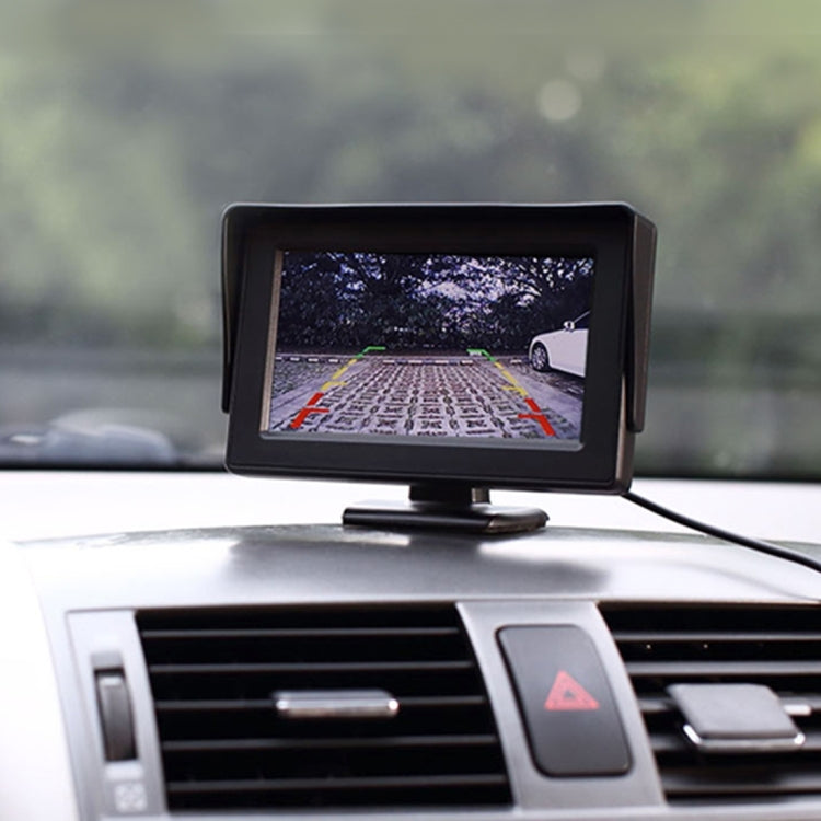 Dashboard-mounted 4.3-inch monitor showing rear parking grid lines