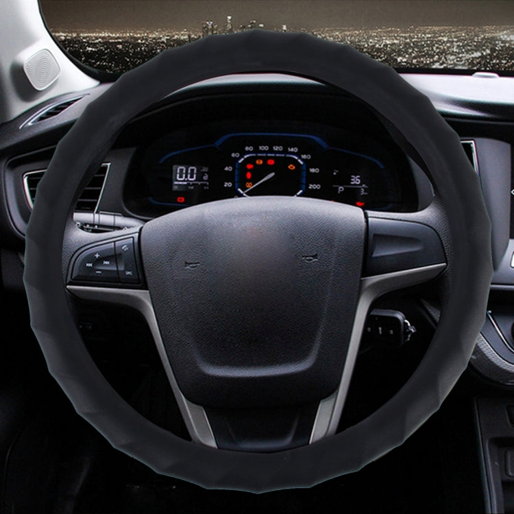 Black textured universal steering wheel cover fitted on car steering wheel
