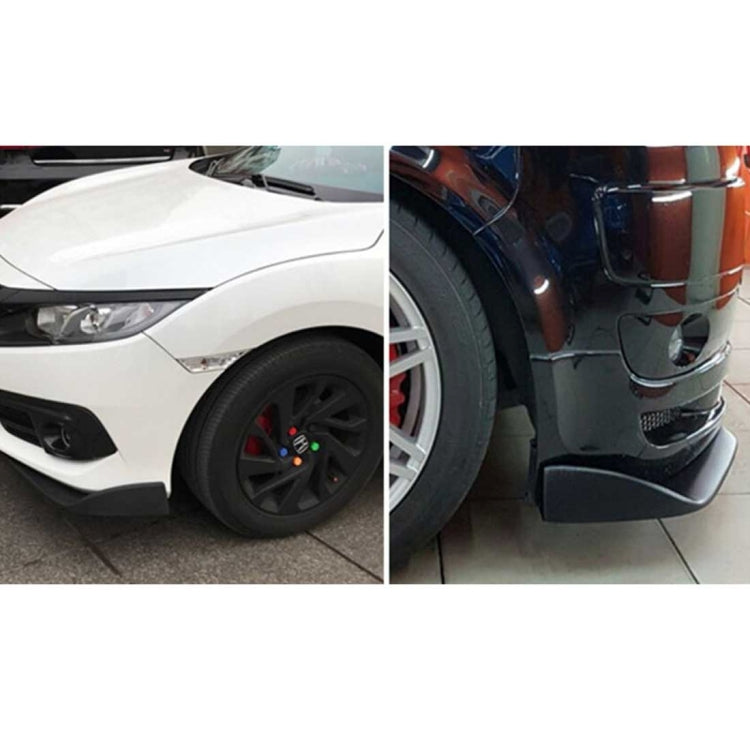 Set of 2 black front bumper spoiler lips installed on a car front corner