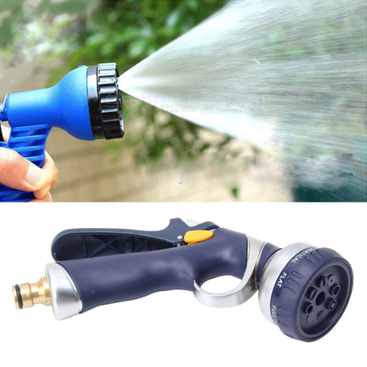 Garden water spray gun with adjustable nozzle, spraying a wide mist stream