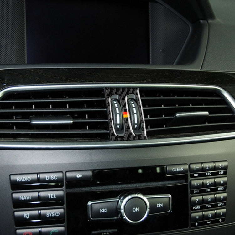 Installed carbon-fiber air outlet sticker with two ovals and German flag stripe
