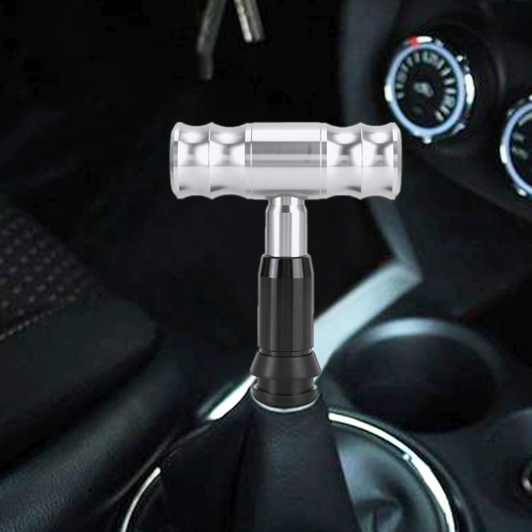 Silver automatic gear shift knob with ribbed grip and metal T-base