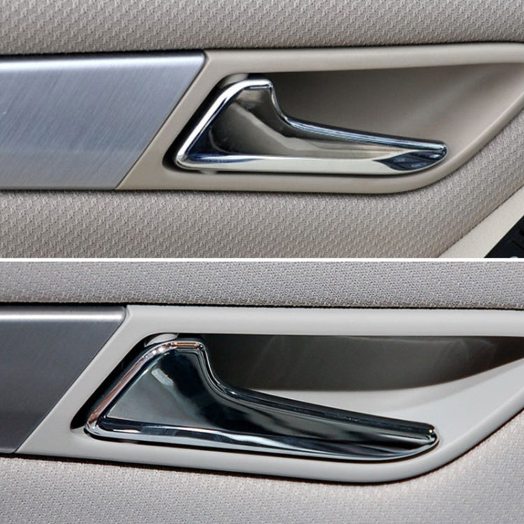 Chrome interior door pull handle trim on door panel with black insert