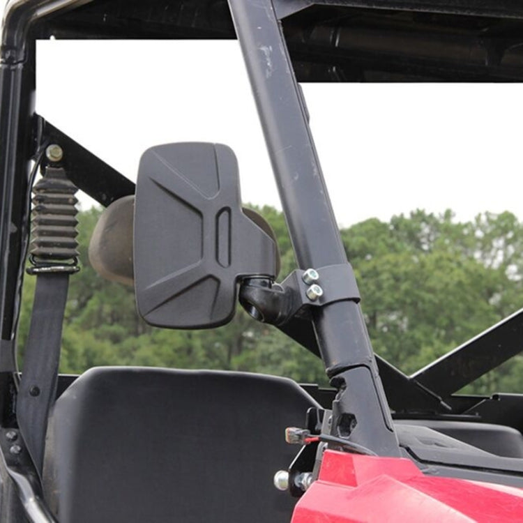 Adjustable side mirror with gray-black housing and clamp bracket on a UTV