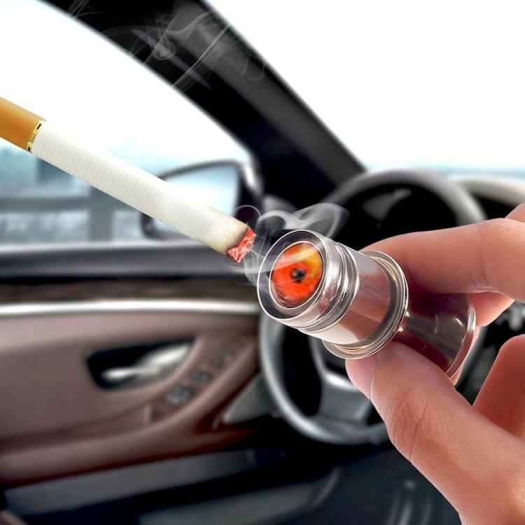 12V nitrous cigarette lighter inserted in vehicle socket, smoking tip in hand