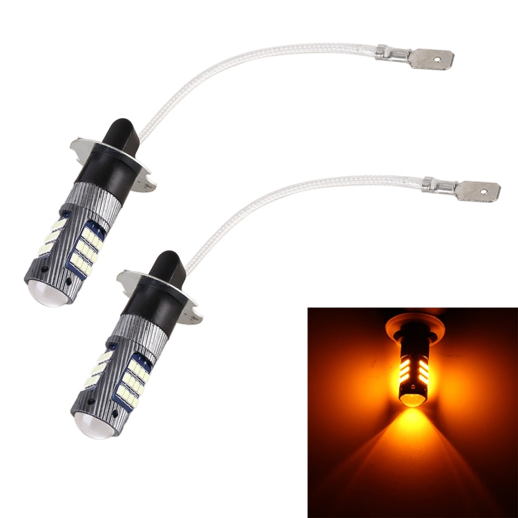 Pair of H3 LED fog light bulbs with wiring, shown with amber glowing light beam
