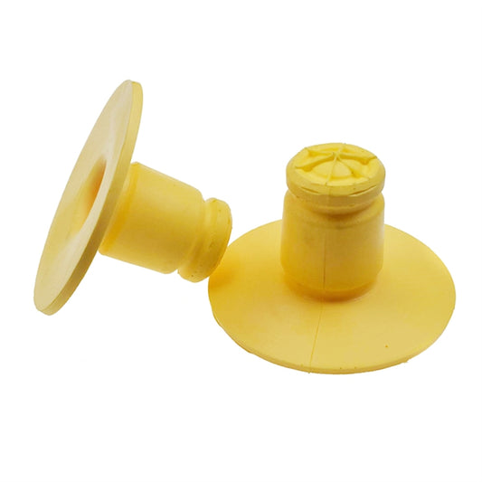 Pair of yellow rear spring bump stop absorbers, round base with central stem