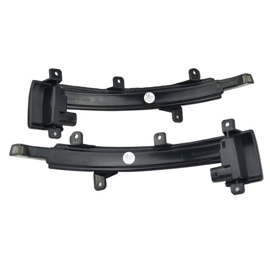 Pair of LED side-mirror turn signal lights in black housing with amber lens