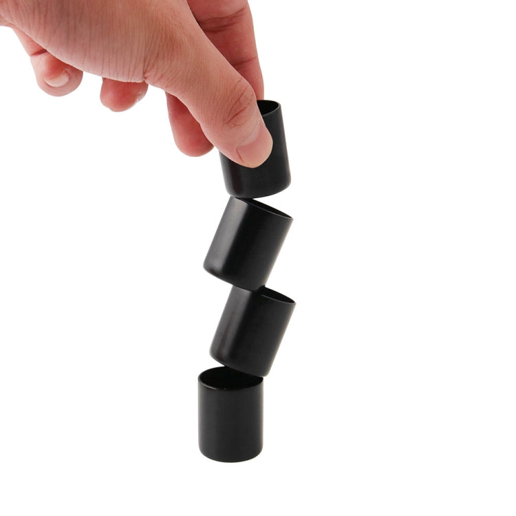 Black docking point cover cap being pulled by hand, cylindrical with open end