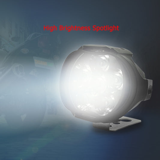 Black motorcycle LED spotlight on bracket with bright white beam