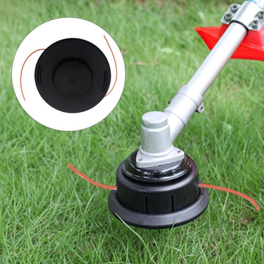 Black plastic trimmer head with dual orange line ends