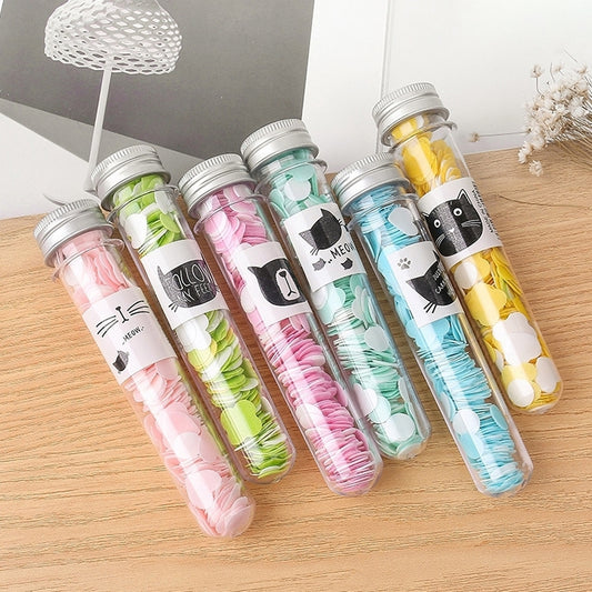 Clear tube-shaped mini soaps with colorful themed soap pieces, boxed set