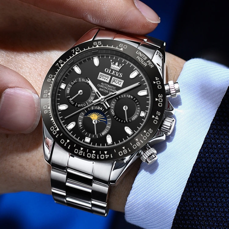Men's mechanical wristwatch with black dial, silver case, bracelet, and side crown