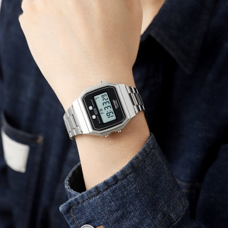 Silver digital sports watch on wrist with square resin case and metal link bracelet