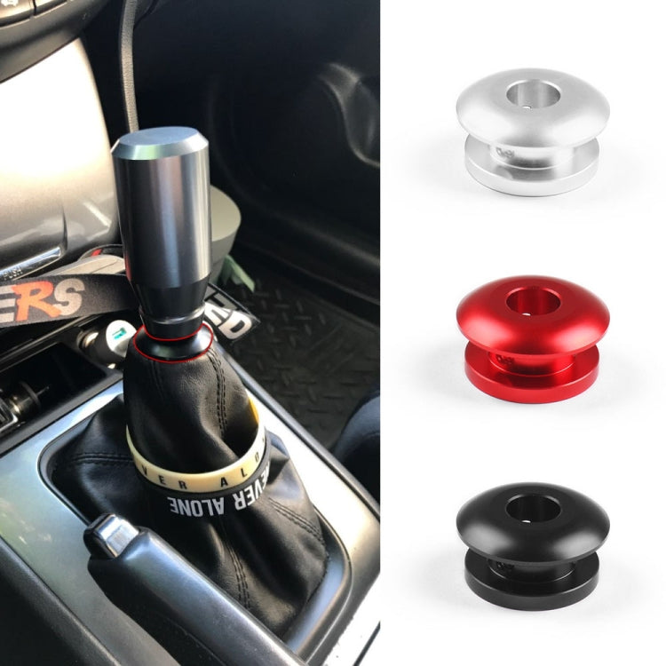 Shift knob stopper kit: black installed on gear shift, plus red and silver stoppers