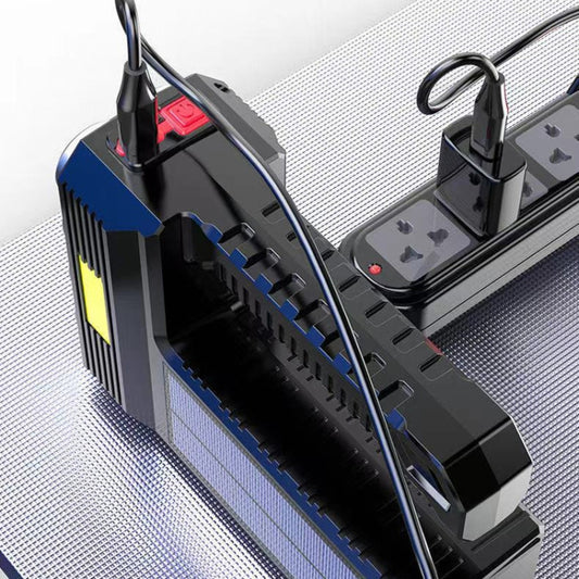 Black flashlight lamp with top control panel, side ports, and hanging loop handles