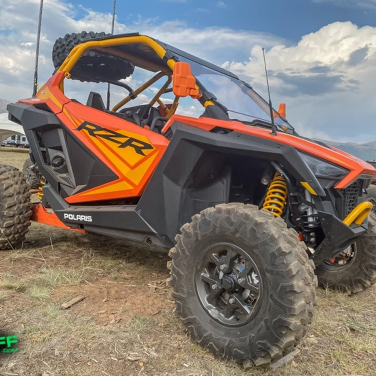 Orange UTV with mounted black rear view side mirrors and mirror housings