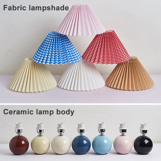 Ceramic desk lamp display with pleated lampshades in blue, red, white, beige and brown