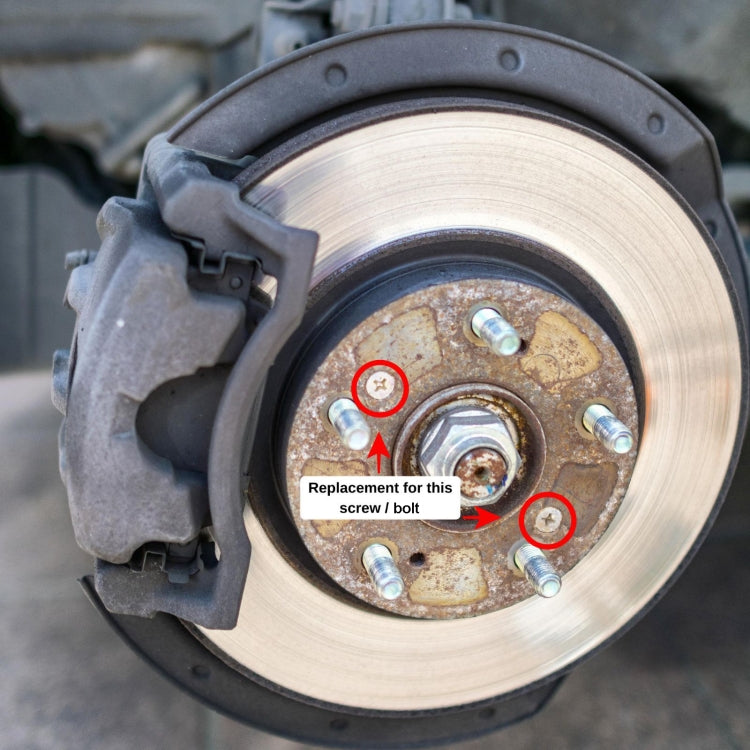 Brake disc rotor with fixing screws installed; two screws highlighted for replacement