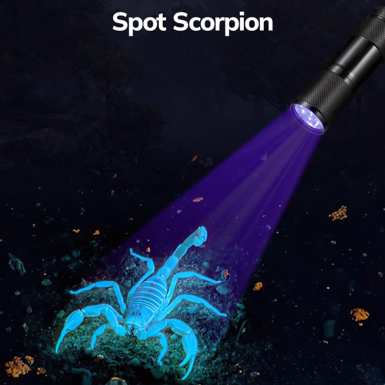 Black UV flashlight emitting a focused violet spotlight beam