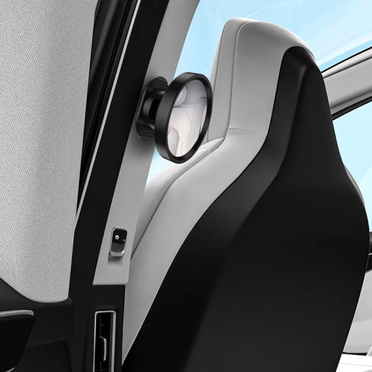 Black-and-silver auxiliary mirror mounted on car seat side panel