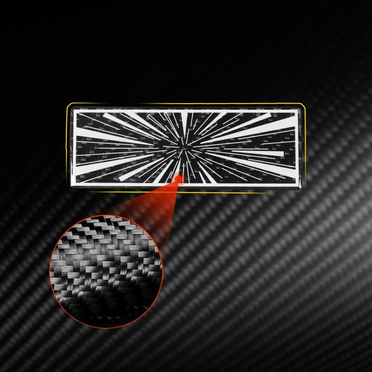 Close-up rectangular carbon-fiber style sticker with white radial burst pattern and texture