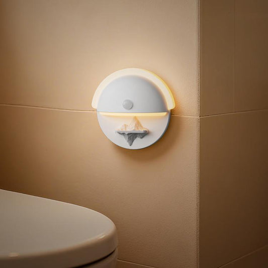 Wall-mounted round rechargeable motion sensor night light with warm white glow