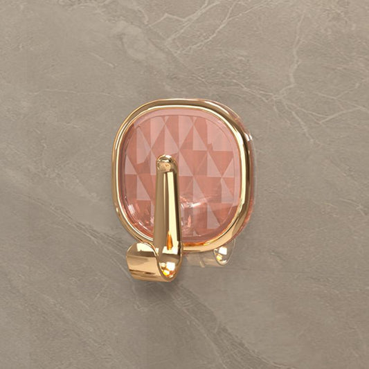 Translucent orange adhesive wall hook with gold-tone metal single hook