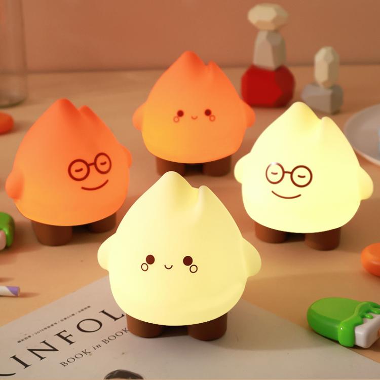 Set of flame night lights in beige and orange tones with smiling faces