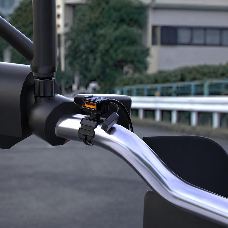 Motorcycle handlebar USB charger with black housing and orange indicator port