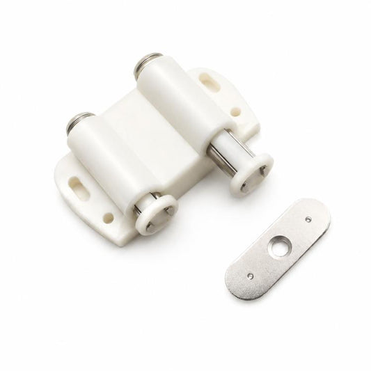 Beige handle-free cabinet door latch with metal mounting plate and striker