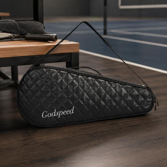 Black quilted badminton racket bag with black trim and zippered top carrying strap