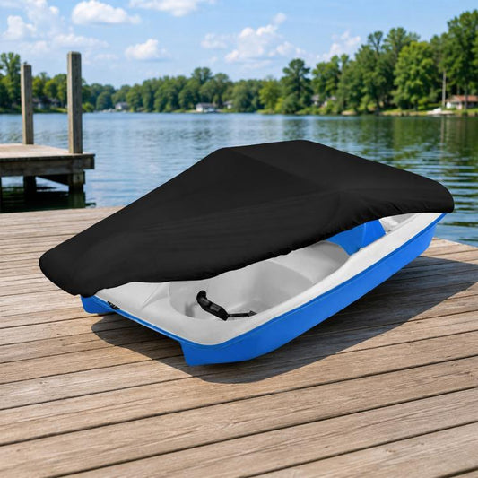 Pedal boat cover with black top fabric and gray interior, secured on a blue pedal boat