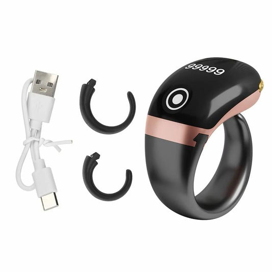 Black smart counting prayer ring with rose-gold accent band and OLED digits on face