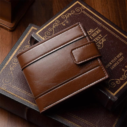 Dark brown leather bi-fold wallet with card slots and front buckle tab.