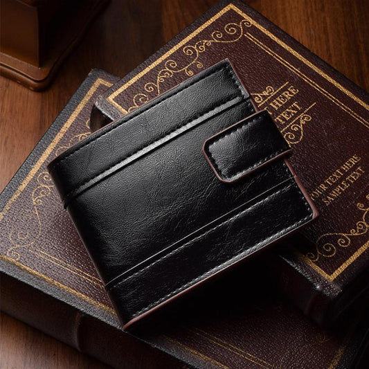 Black leather bi-fold wallet with card slots and front buckle tab detail.
